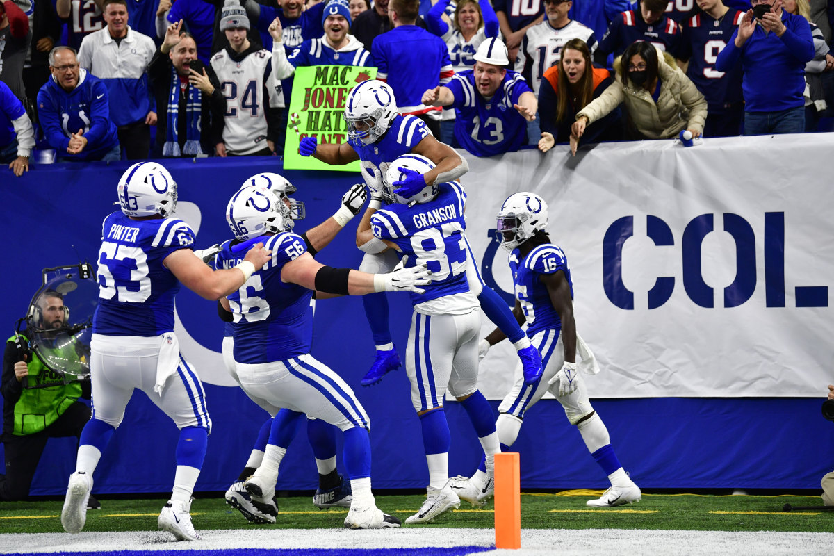 Dec 18, 2021; Indianapolis, Indiana, USA; Indianapolis Colts running back Jonathan Taylor (28) celebrates a run for a 69 yard touchdown during the second half against the New England Patriots at Lucas Oil Stadium. Colts won 27-17. Mandatory Credit: Marc Lebryk-USA TODAY Sports